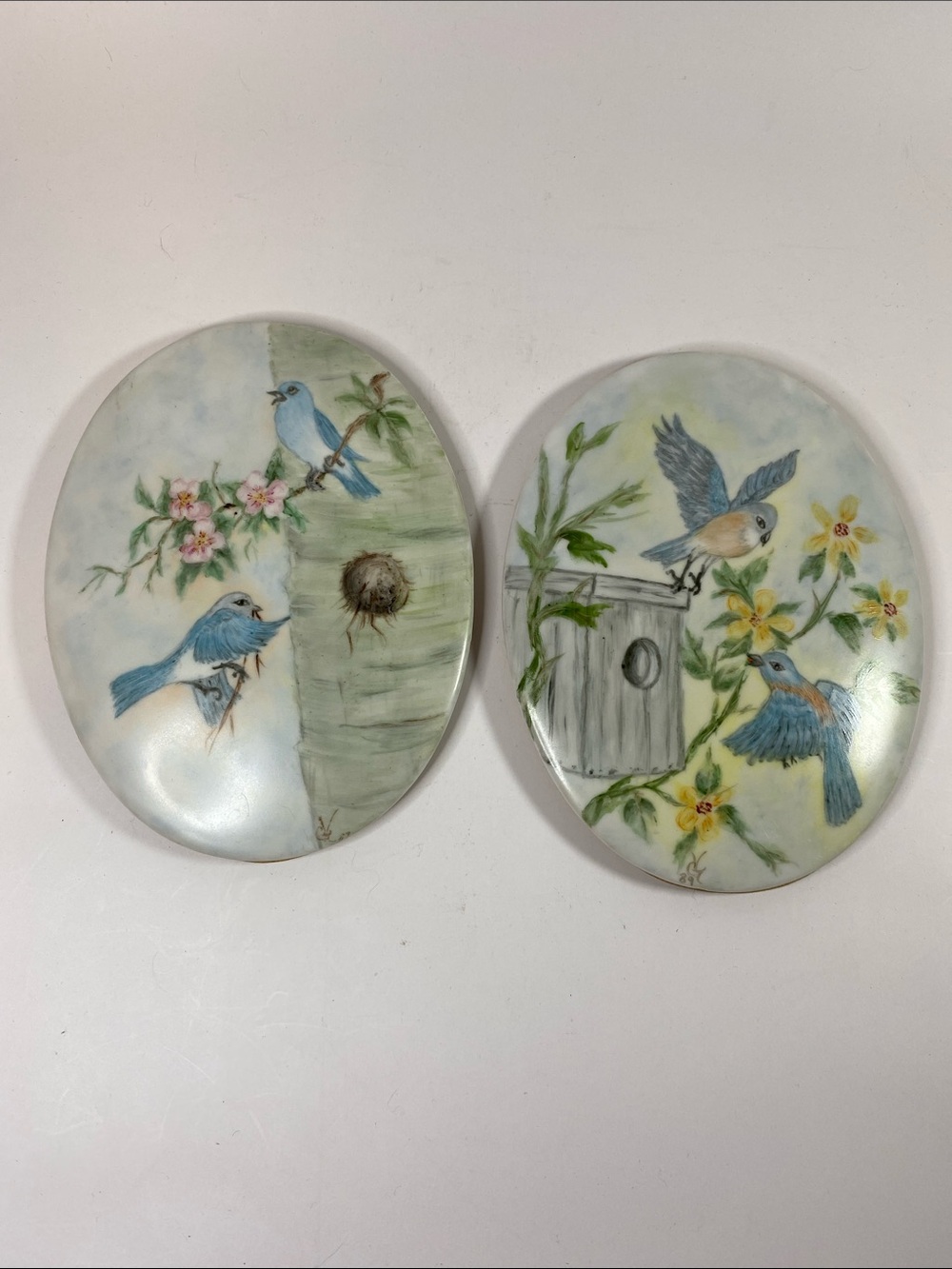 Vintage plaques with bird and floral designs